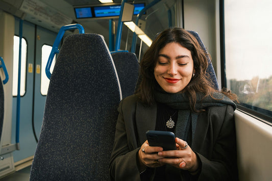 Women travelling on a train using mobile phone with unlimited data