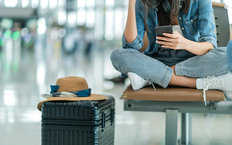 Woman sitting cros legged on phone